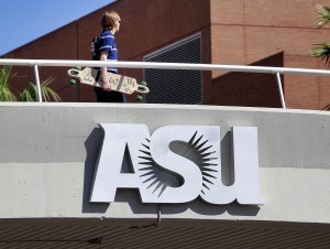 A student walks over Univeristy Ave on the Arizona State University campus Thursday, Sept. 23, 2010 in Tempe, Ariz. The Arizona Board of Regents is scheduled to vote on a proposal to cut back on scholarships for students who perform well on the state's high school graduation test. The universities say the scholarships are costing millions that should be spent on students with financial needs (AP Photo/Matt York)