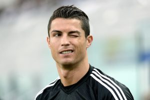 Real Madrid's Cristiano Ronaldo winks during a training session ahead of Tuesday's Champions League semifinal first leg soccer match between Juventus and Real Madrid, at Turin's Juventus Stadium, Italy, Monday, May 4, 2015. (AP Photo/Massimo Pinca)