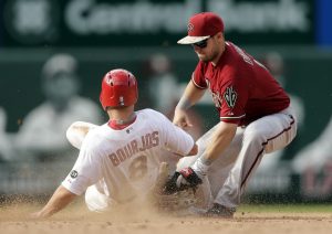 Arizona Diamondbacks second baseman Chris Owings, right, tags St. Louis Cardinals' Peter Bourjos out at second on a steal attempt during the eighth inning of a baseball game Monday, May 25, 2015, in St. Louis. (AP Photo/Jeff Roberson)