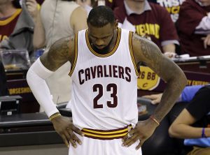 Cleveland Cavaliers forward LeBron James (23) hangs his heads during the second half of Game 6 of basketball's NBA Finals against the Golden State Warriors in Cleveland, Tuesday, June 16, 2015. The Warriors defeated the Cavaliers 105-97 to win the best-of-seven game series 4-2. (AP Photo/Darron Cummings)