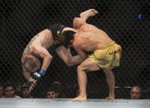 Henry Cejudo, right, battles against Chico Camus, both from the United States ,during a men's flyweight UFC 188 mixed arts bout in Mexico City, Saturday, June 13, 2015. Cejudo won the fight by decision. (AP Photo/Christian Palma)