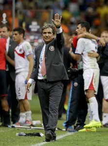 FILE - In this July 5, 2014 file photo, Costa Rica head coach Jorge Luis Pinto waves after a penalty shoot out during the World Cup quarterfinal soccer match between the Netherlands and Costa Rica at the Arena Fonte Nova in Salvador, Brazil.  The Colombia-born manager has decided to leave the Costa Rica national team. (AP Photo/Matt Dunham, File)