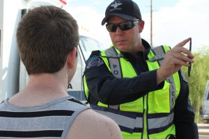 A Mesa police officer tests eye movements of a driver pulled over during a September 2010 DUI checkpoint. Officers and city officials say that prescription drug use is a rising cause of driver impairment in Arizona, and they're increasing drug recognition training to identify drivers affected by substances other than alcohol. (Cronkite News Service Photo by Rebekah Zemansky)