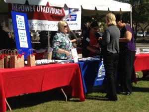 An American Cancer Society booth promotes the group’s priorities, including a law against minors using tanning beds, during Cancer Awareness Day at the Capitol on Wednesday, Feb. 25.