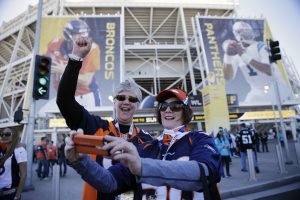 Cathey Steadman, left, and Angie Blackford take a selfie outside Levi's Stadium before the NFL Super Bowl 50 football game Sunday, Feb. 7, 2016, in Santa Clara, Calif. (AP Photo/Jae C. Hong)